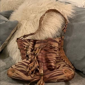 Tiger striped suede bag with brass studs.